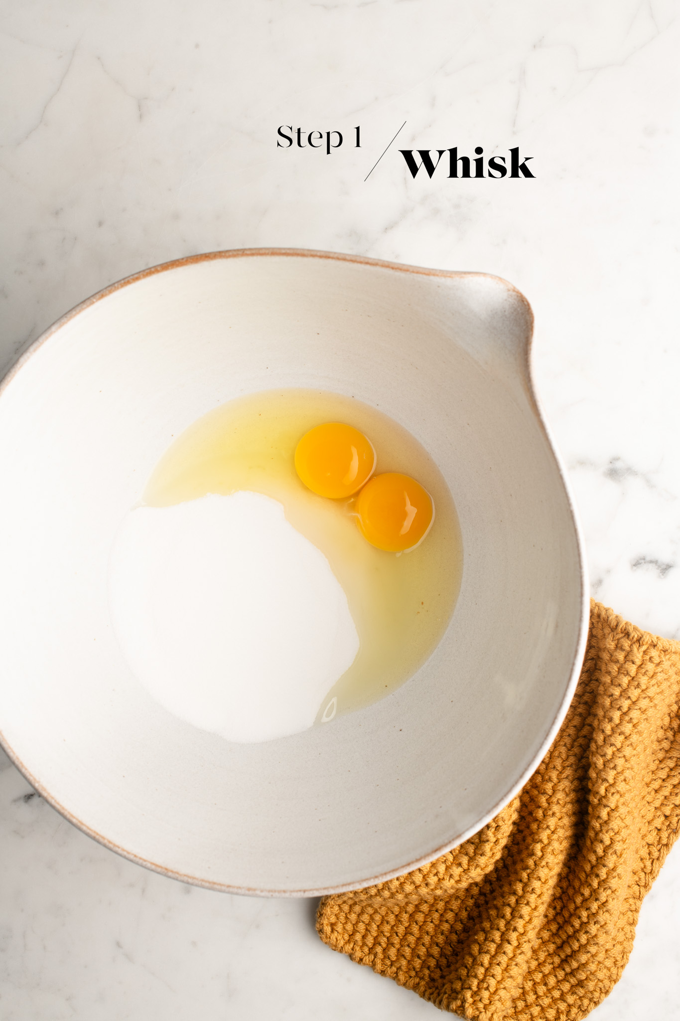 eggs and sugar in white mixing bowl