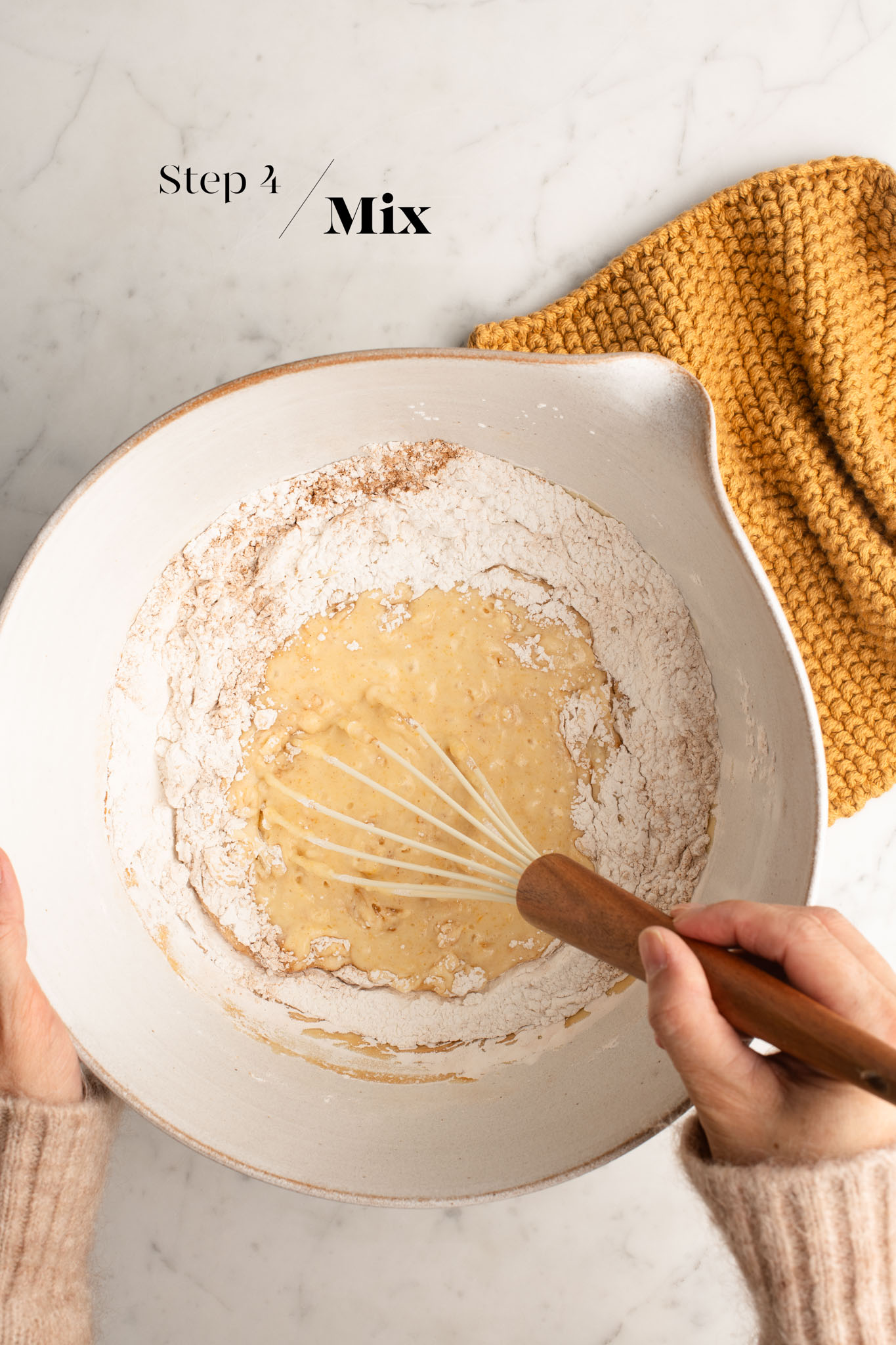 mixing mochi batter in white mixing bowl