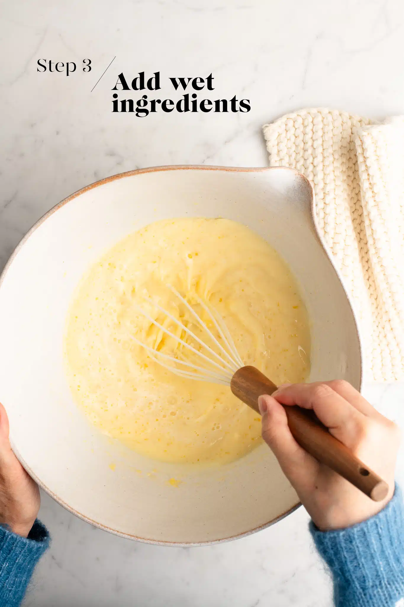 whisking batter for shanghai butter mochi in white mixing bowl