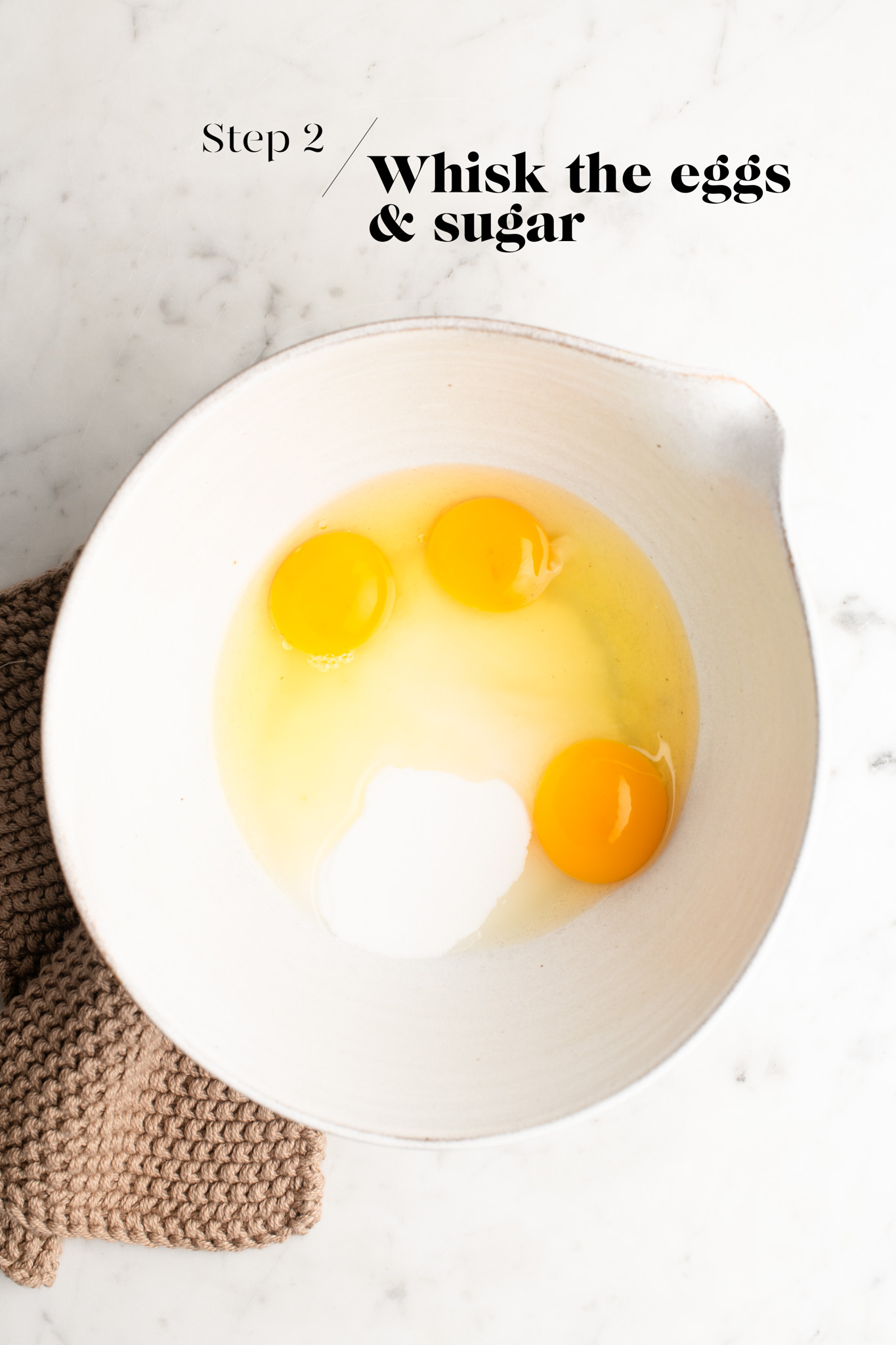 eggs and sugar in white mixing bowl