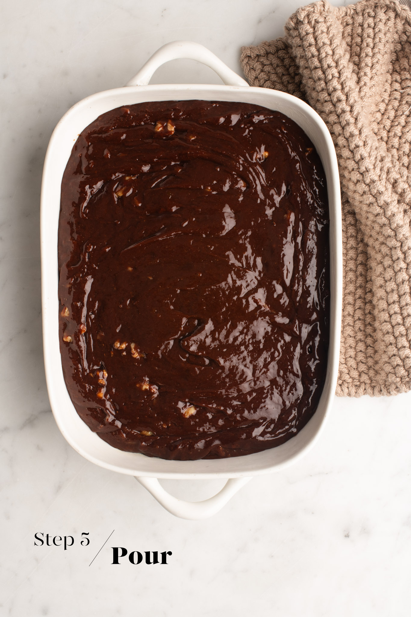 brownie batter in white ceramic dish
