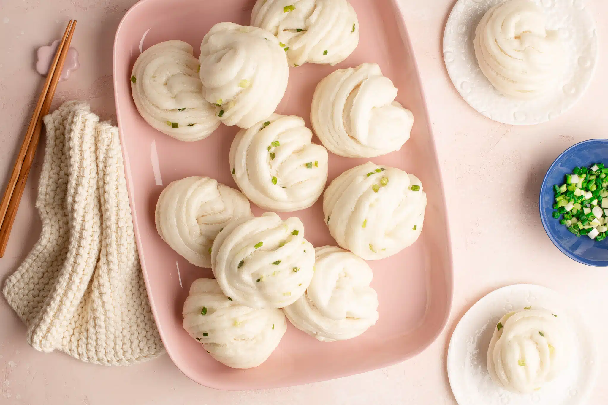 scallion flower buns or spring onion flower buns on pink platter