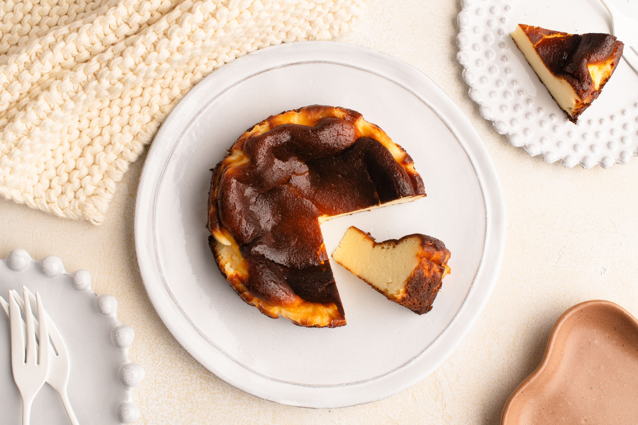 mini basque cheesecake on white plate