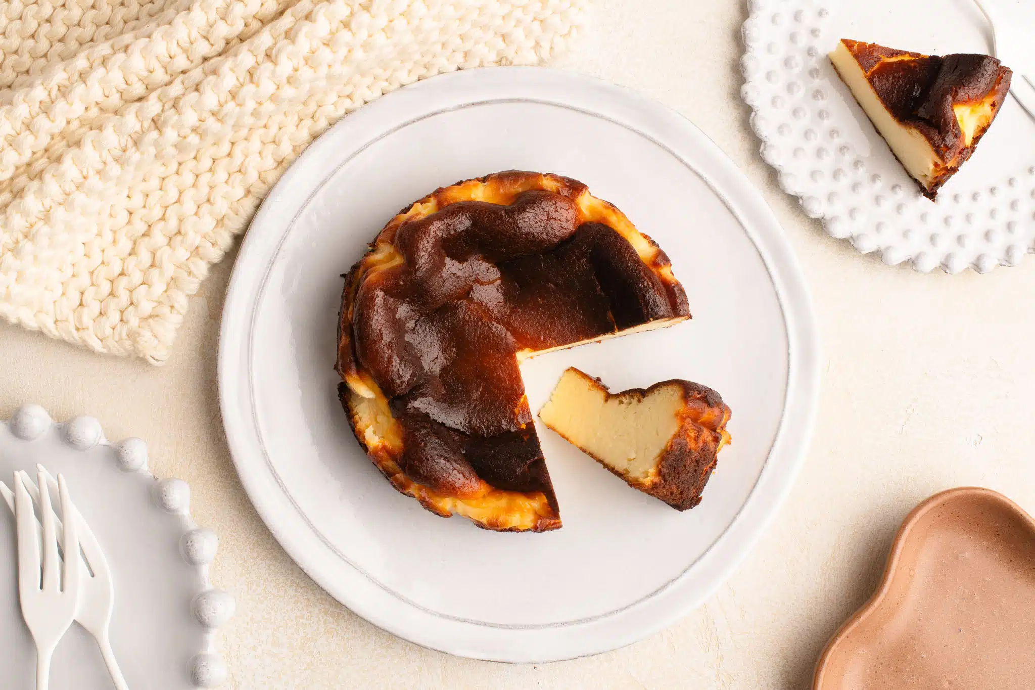 mini basque cheesecake on white plate