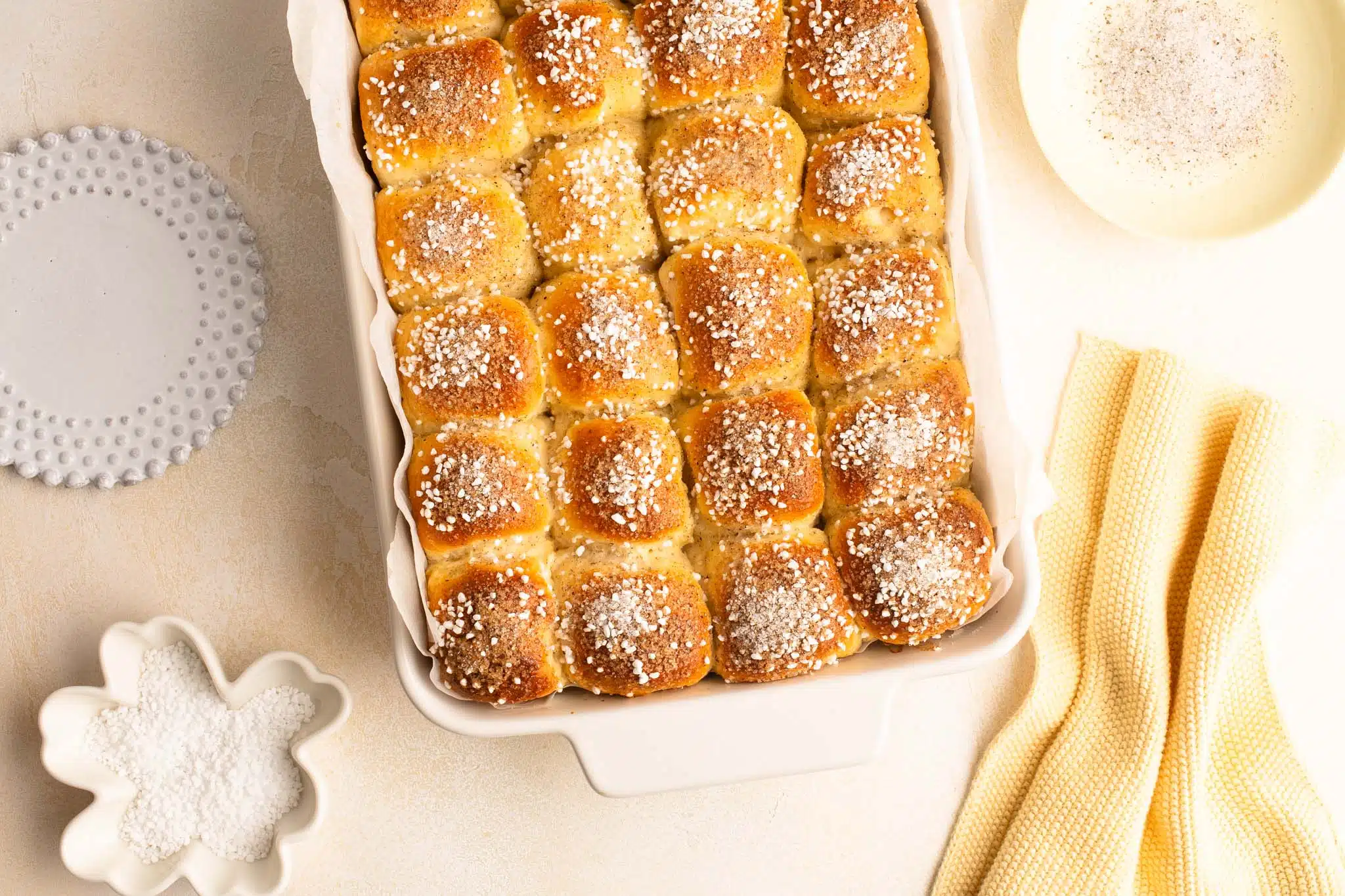 mini cardamom buns in white baking dish