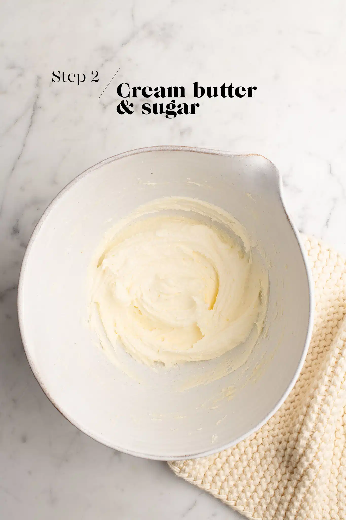 creamed butter and sugar in white mixing bowl