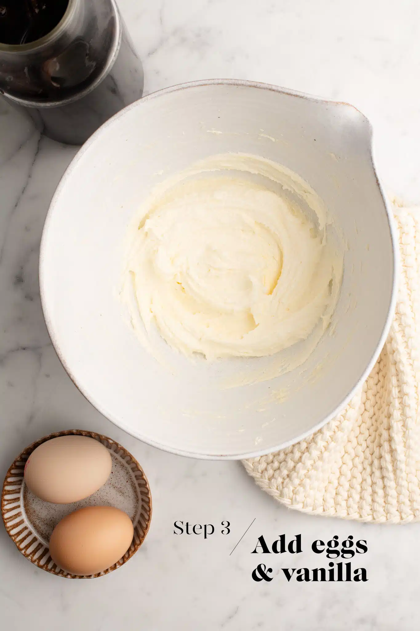 batter for banana bread in white mixing bowl