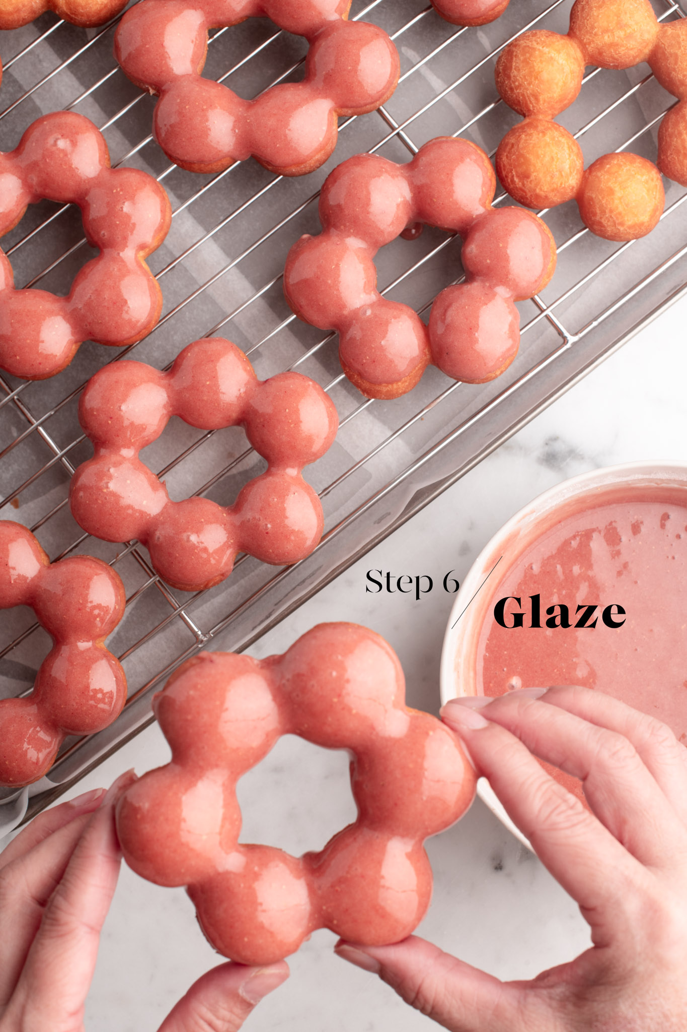 glazing mochi donuts on wire rack