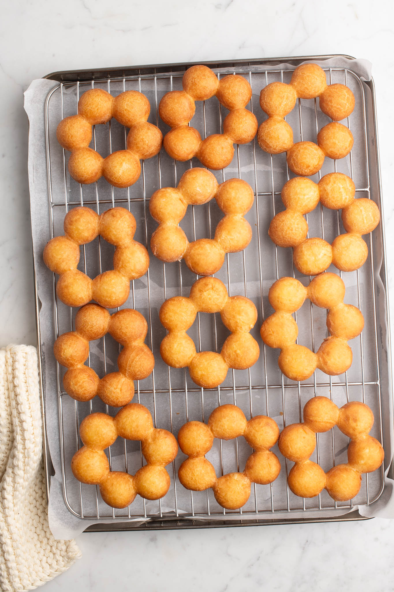 fried mochi donuts on wire rack